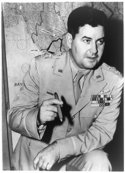 [Curtis E. LeMay, three-quarter length portrait, standing, facing right; holding cigar, in front of map in U.S. Capitol]