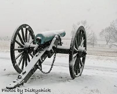 Civil War cannon with wheels in falling snow