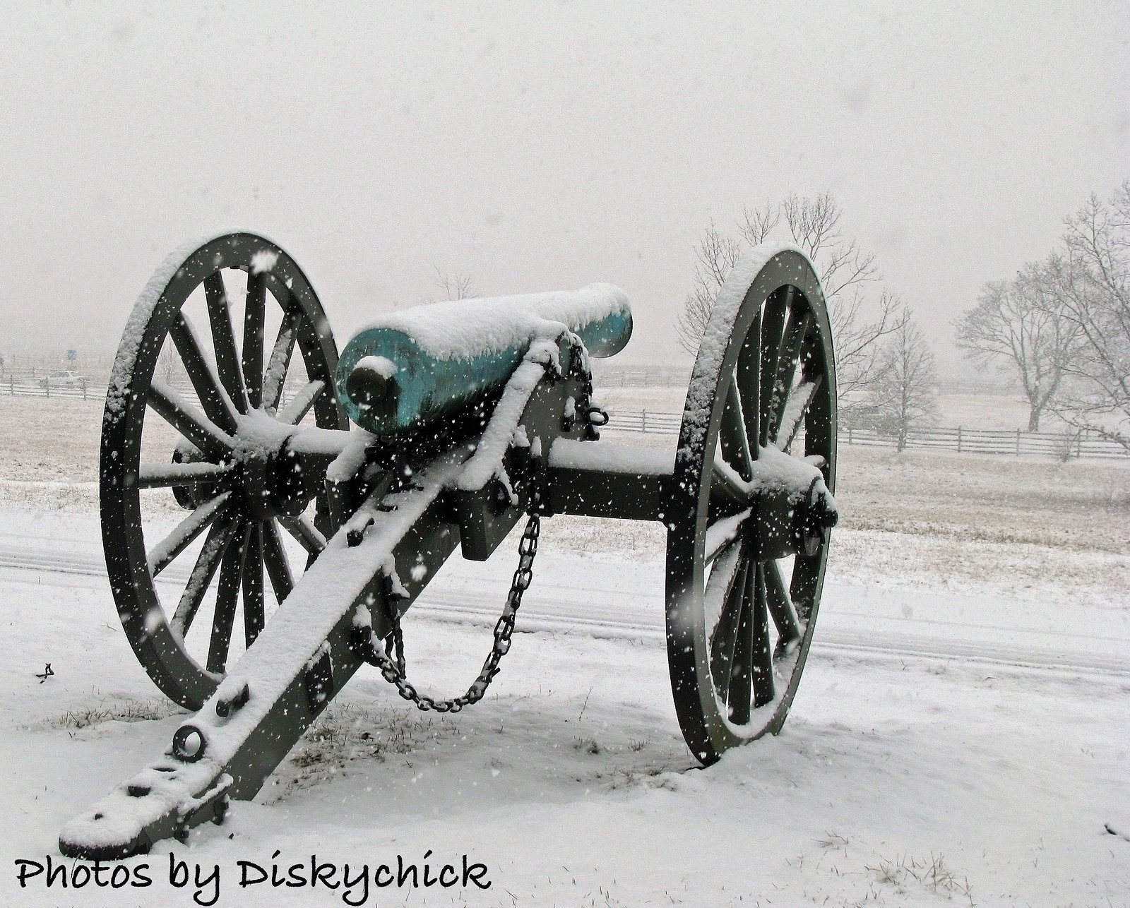 Civil War cannon with wheels in falling snow — historic image
