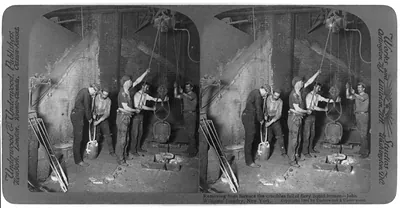 Removing from furnace the crucibles full of fiery liquid bronze - John Williams' foundry, New York [City]