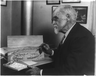 [William Henry Jackson, 1843-1942, half-length portrait, seated, facing left, finishing one of his paintings of the Oregon Trail]