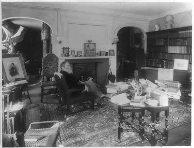 [James Russell Lowell, 1819-1891; full length, facing right, seated in room]