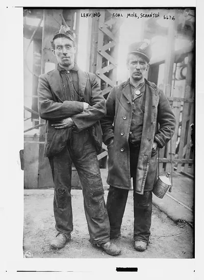 Two miners ready to leave entrance of coal mine near Scranton, PA.