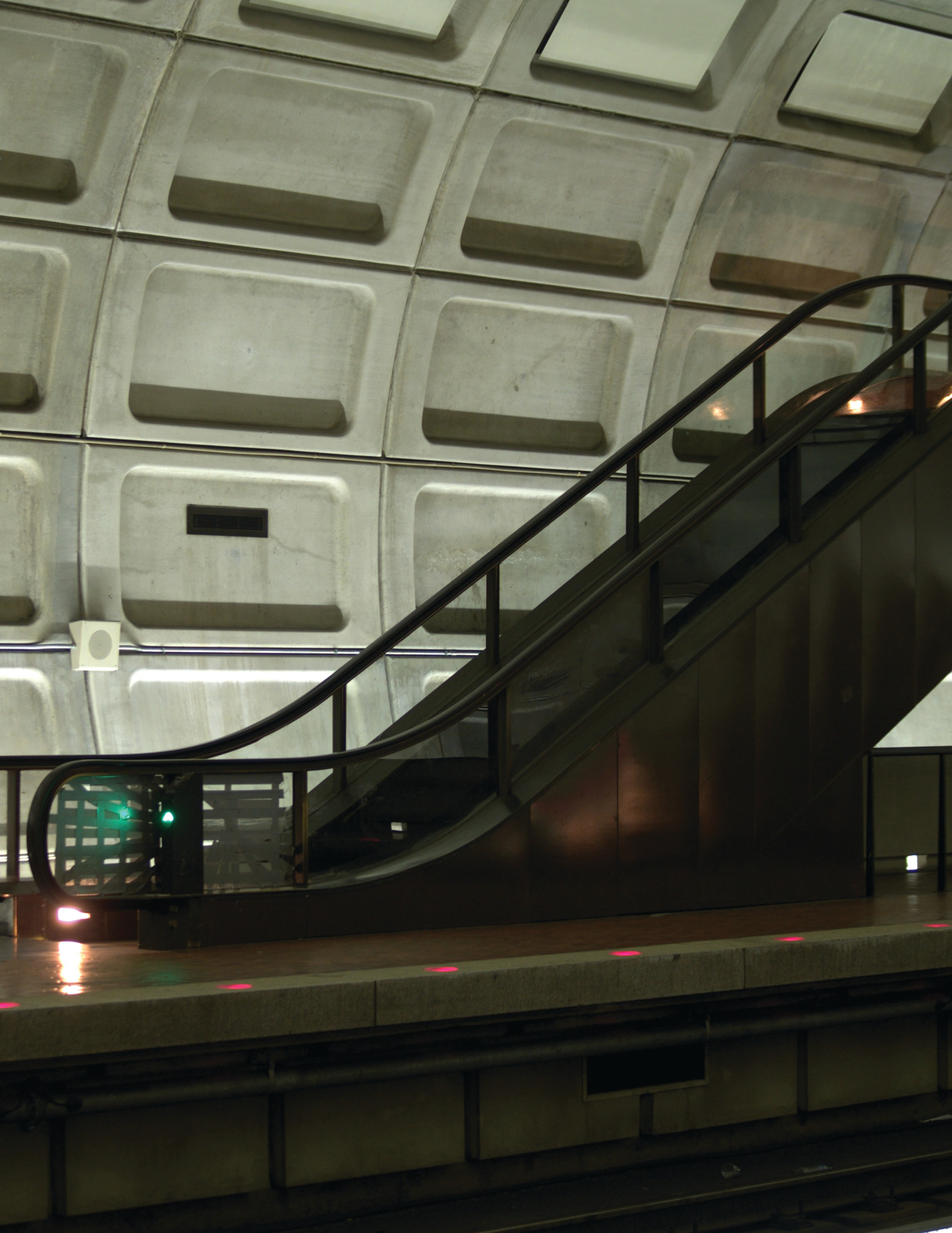 Escalator in a metro station with coffered concrete ceiling — historic image
