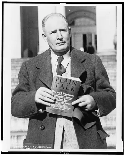 [Walter W. Liggett, half-length portrait, facing front holding issue of Plain Talk"]"