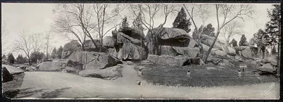 Large boulders and bare trees beside a road, Devil's Den