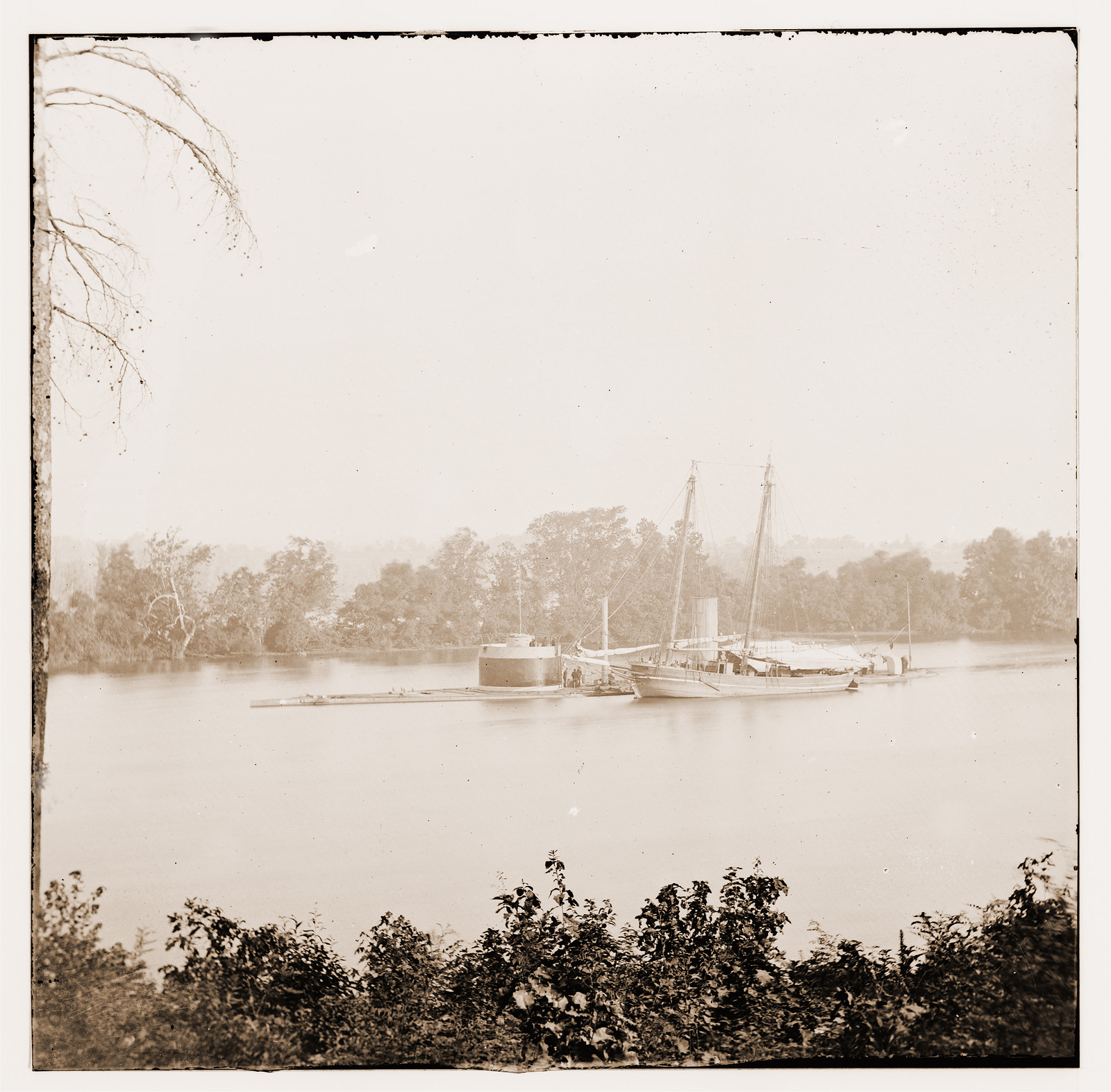 James River Virginia. U.S.S. monitor CANONICUS taking coal from a schooner, 1861 — historic photograph