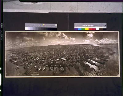 Photograph of San Francisco in ruins from Lawrence Captive Airship, 2000 feet above San Francisco Bay overlooking water front. Sunset over Golden [Gat]e