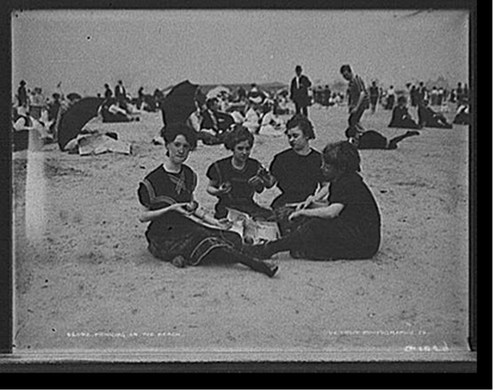 Picnicing on the beach, [between 1900 and 1905] — historic photograph
