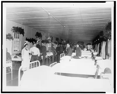 [Soldiers and nurse in military hospital, during Christmas season]