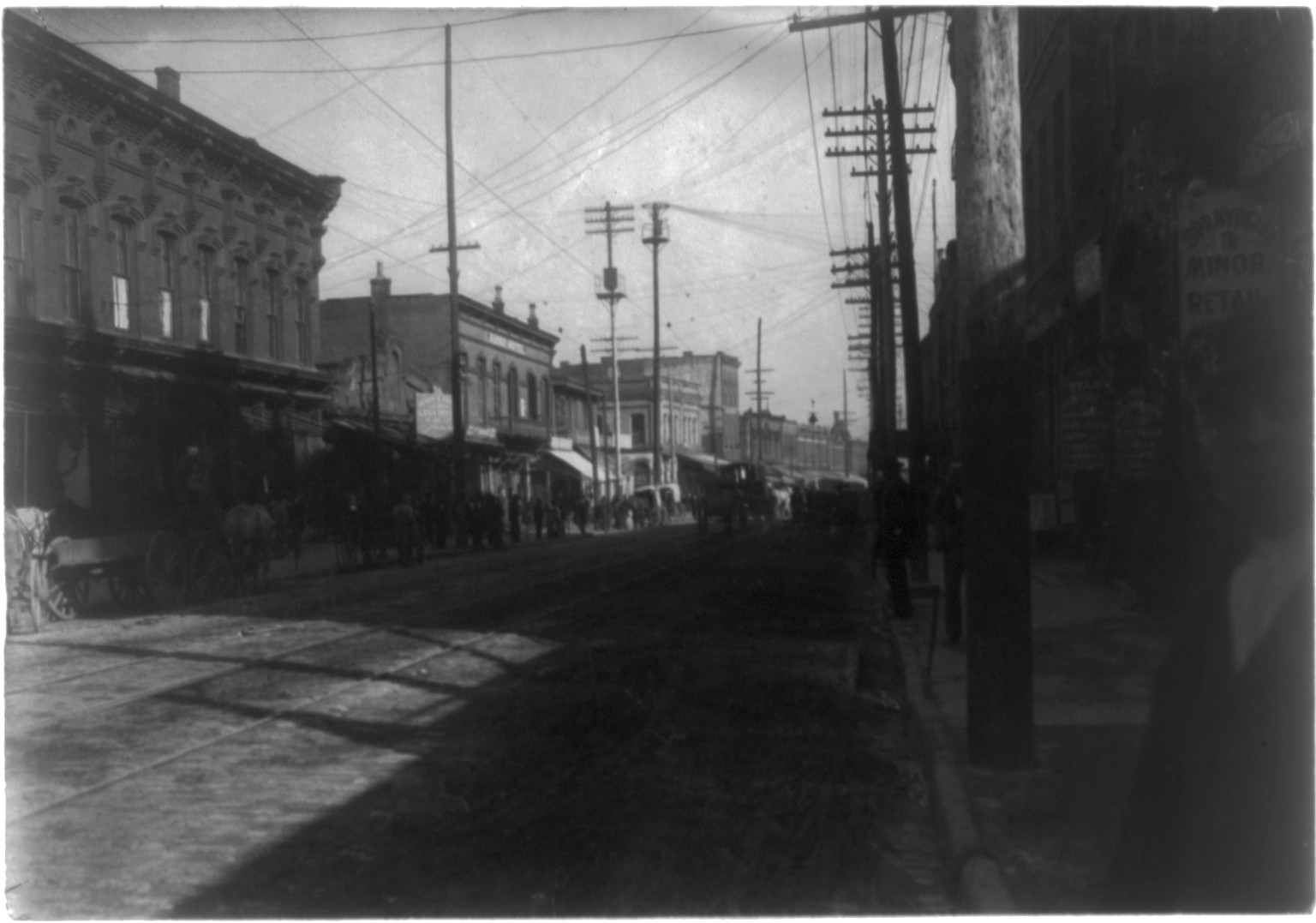 [Street scene in business district, possibly in Atlanta, Georgia], [1899 or 1900] — historic photograph