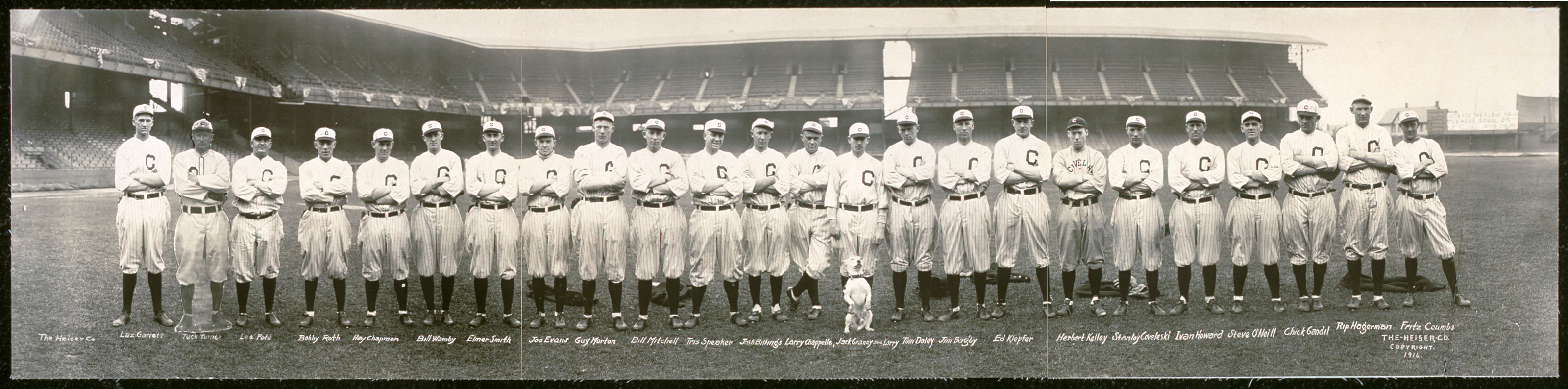 Panoramic photograph of baseball team in C caps before stadium, 1916 — historic photograph