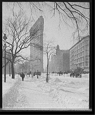 Flat-iron [i.e. Flatiron Building] corner after snow storm, New York