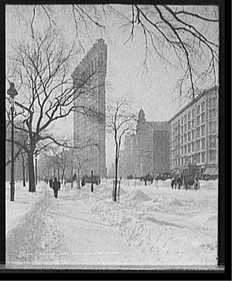 Flat-iron [i.e. Flatiron Building] corner after snow storm, New York, c1905. — historic photograph