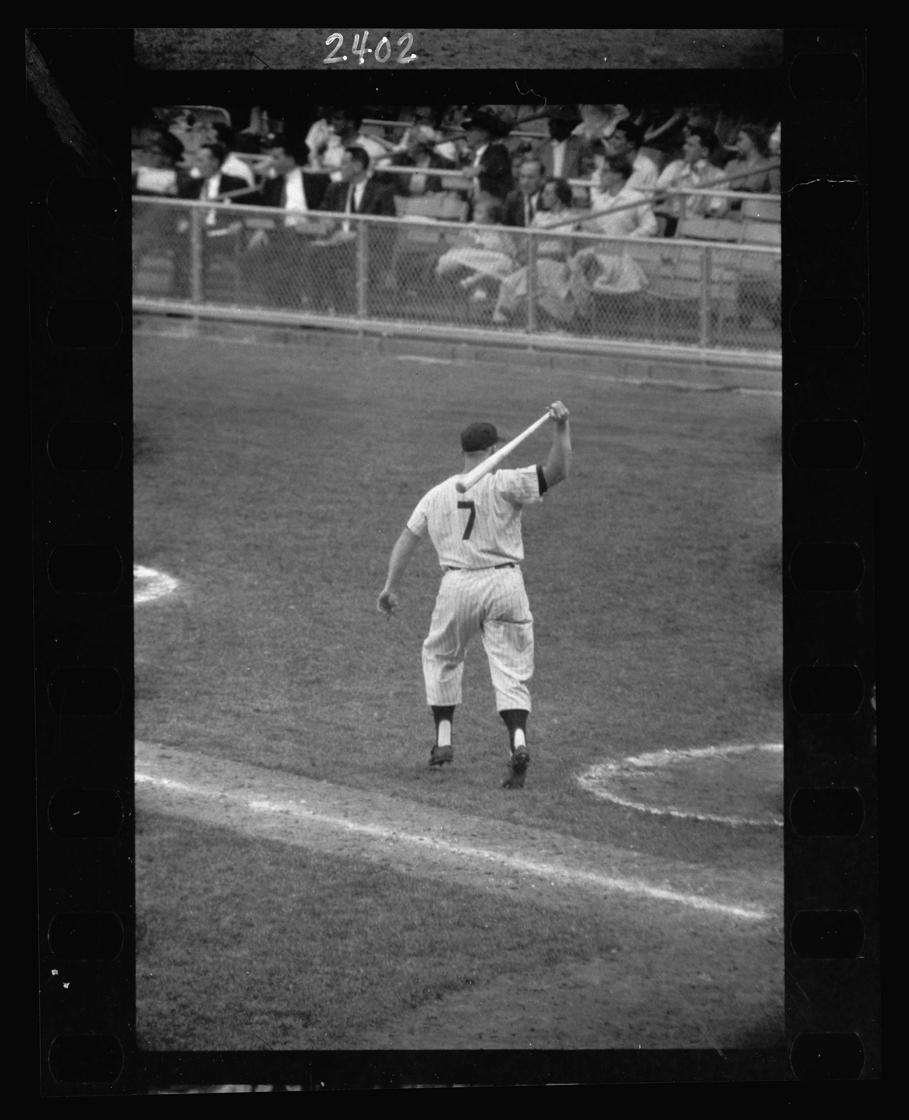 [Rear view of New York Yankee baseball player Mickey Mantle with bat swung over his shoulder] / Marvin E. Newman. — historic photograph