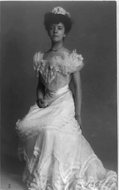 [Mrs. Alice (Roosevelt) Longworth, full-length portrait, facing left; wearing ball gown]