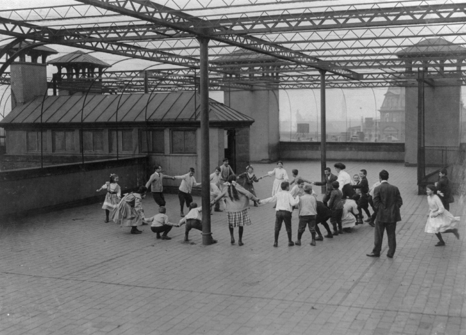 Immigrant Children Learning to Play on the Roof Garden of the Washington School. Boston 1915 Exhibit. Location: Boston, Massachusetts., 1909 October. — historic photograph