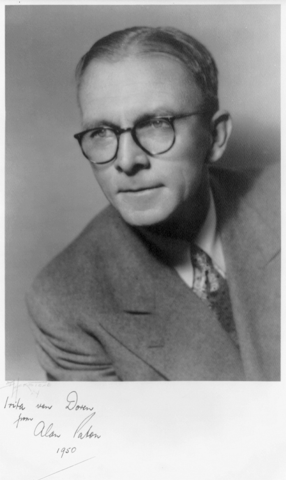 [Alan Paton, head and shoulders, facing left, autograph] — historic photograph
