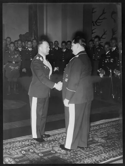 [Erhard Milch shaking Göring's hand during birthday celebration]