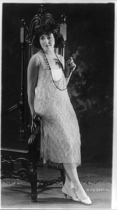 [Woman modeling evening gown]
