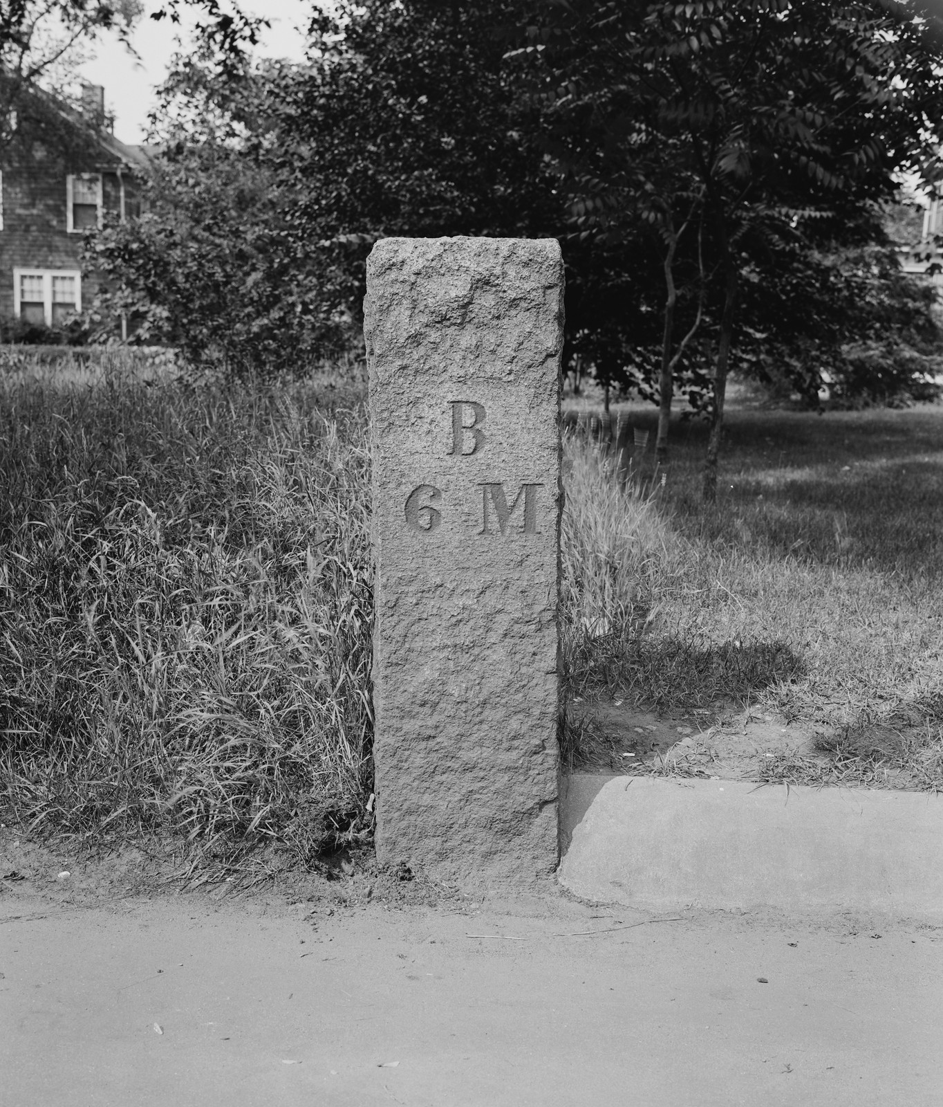 Granite roadside marker inscribed B 6 M — historic image