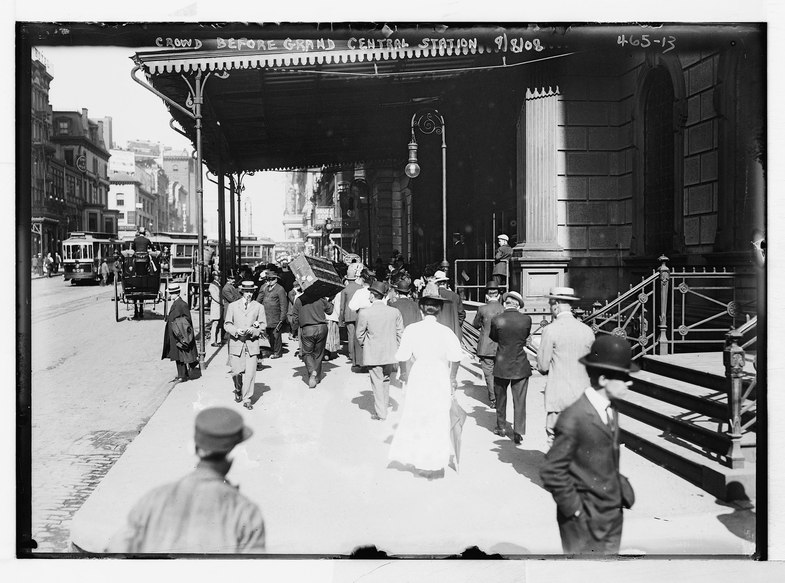 Porters and crowd outside Grand Central Station, New York, n/a — historic photograph