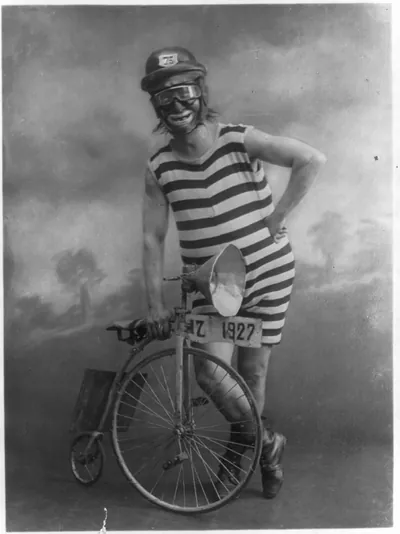 [Circus clown with small bicycle]