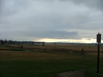 Overcast Battlefield Fields with Fences, Monuments and Interpretive Sign