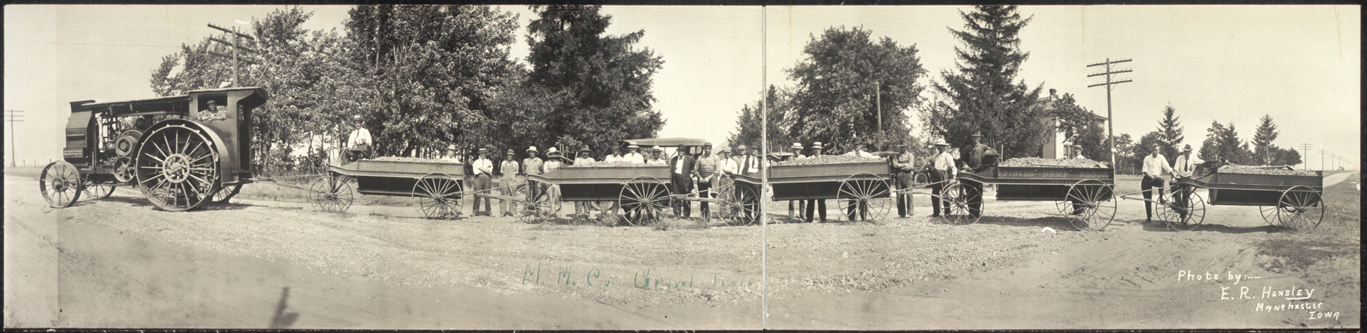 Steam tractor and gravel wagons with workmen — historic image