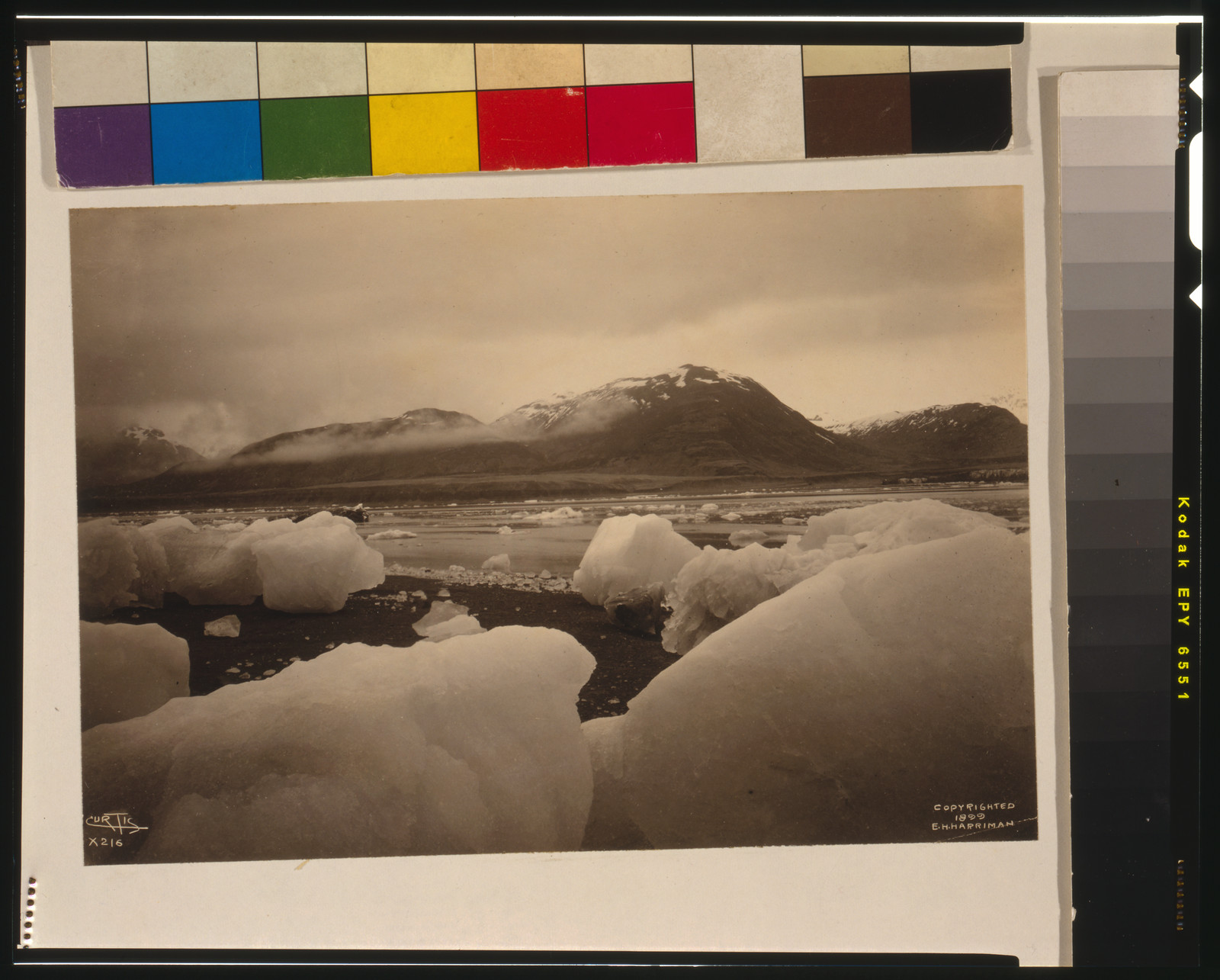 [Icebergs, bay, and mountain in background, Alaska] / Curtis., c1899. — historic photograph
