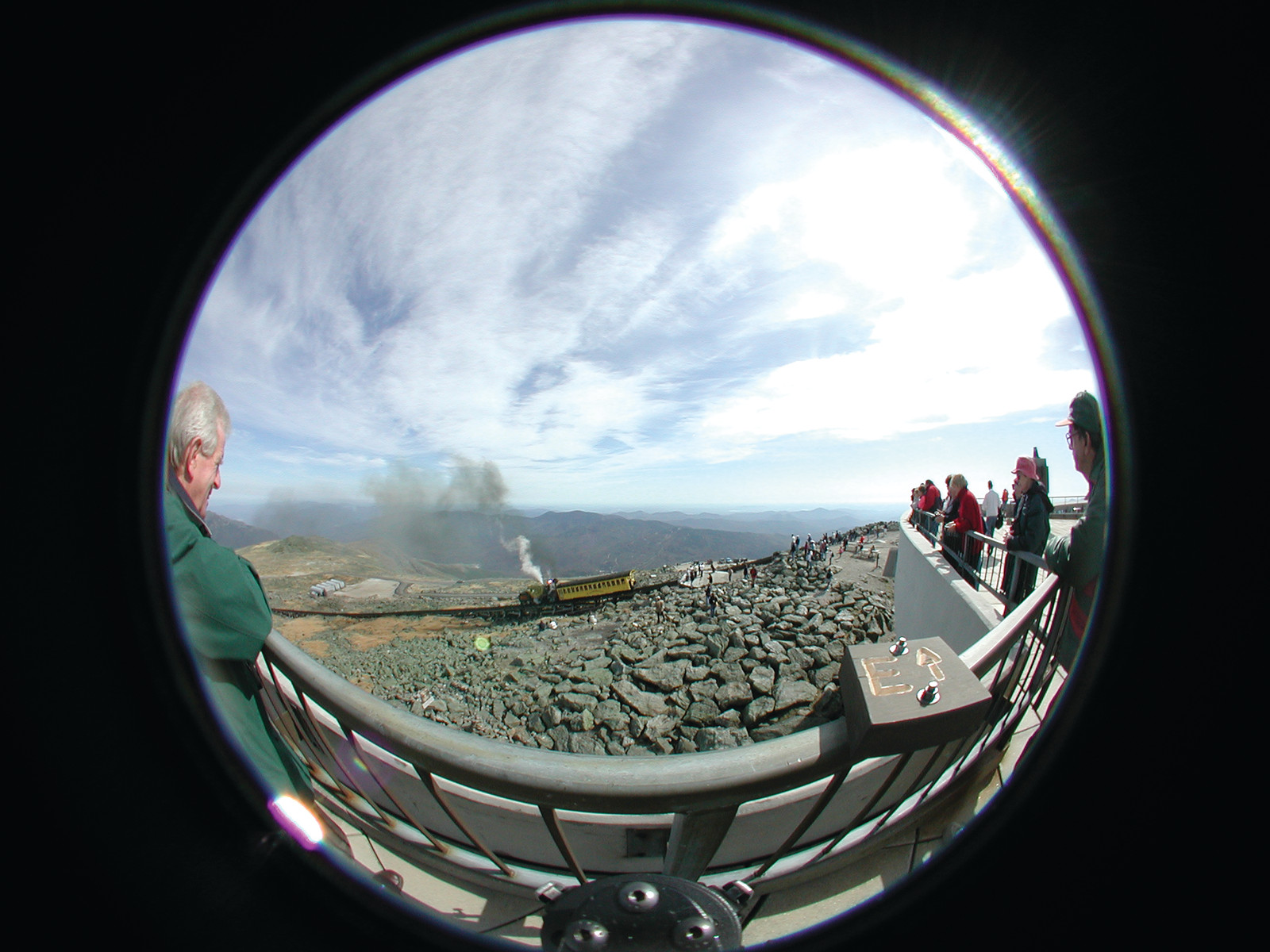 Steam cog railway train below a mountain summit observation deck — historic image