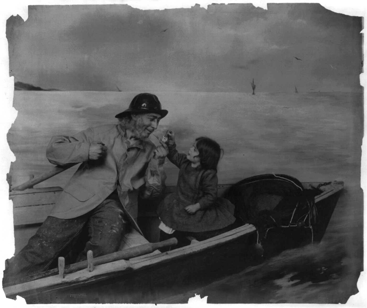 [Girl lighting pipe for old fisherman in boat], c1902. — historic photograph
