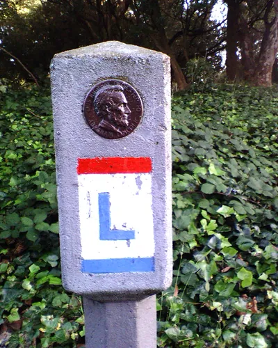 Concrete Lincoln Highway marker with bronze Lincoln medallion