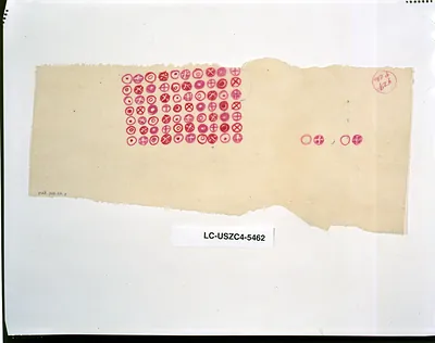 Torn sheet with rows of pink circled crosses and dots