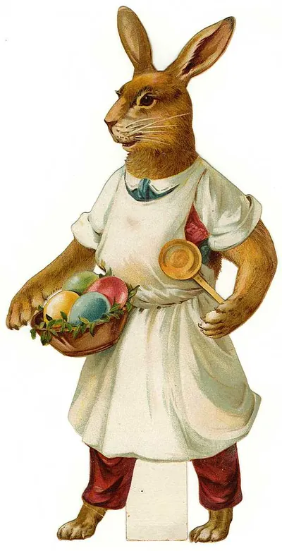 Rabbit in apron holding basket of painted Easter eggs