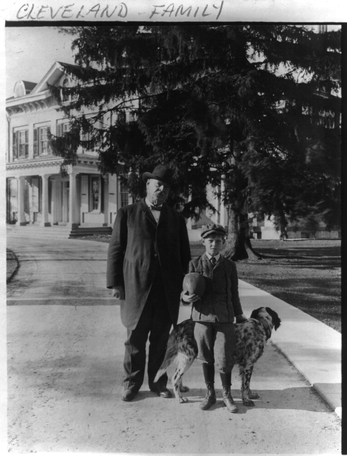[Grover Cleveland, his son and dog posed on driveway, with house in backgrd. Princeton, N.J.], c1906. — historic photograph
