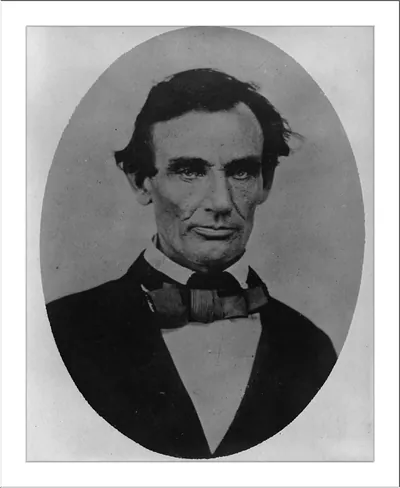 Oval sepia portrait of a man in dark coat and bow tie