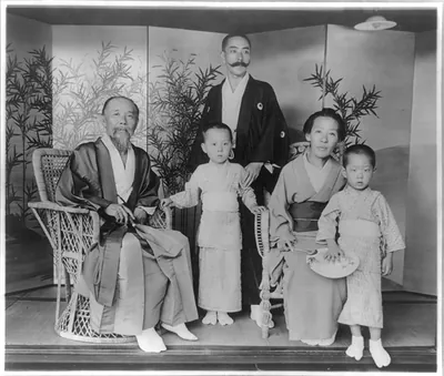 [Hirobumi Ito, 1841-1909, full-length portrait, seated, with wife, son and grandsons]