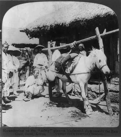 Horseshoeing on the safety" plan - a blacksmith shop outside the East Gate Korea"
