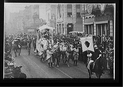 [Mardi Gras day, Rex passing up Camp Street, New Orleans]