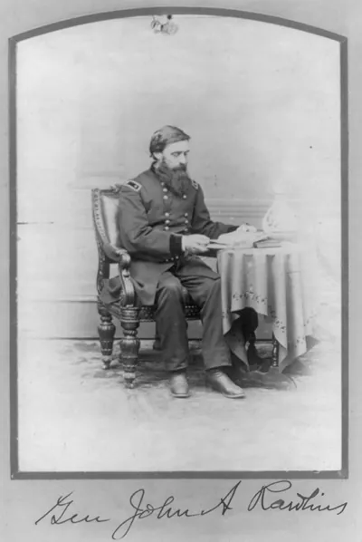 [John Aaron Rawlins, 1831-1869, full length, seated, facing right; at table reading; General]