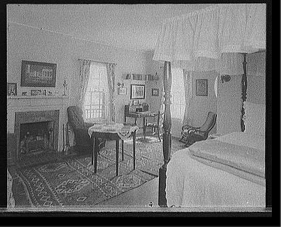 [Bedroom with fireplace], [between 1900 and 1920] — historic photograph