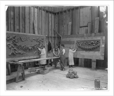 [World's Columbian Exposition, Chicago, under construction: Men working on stone ornaments]