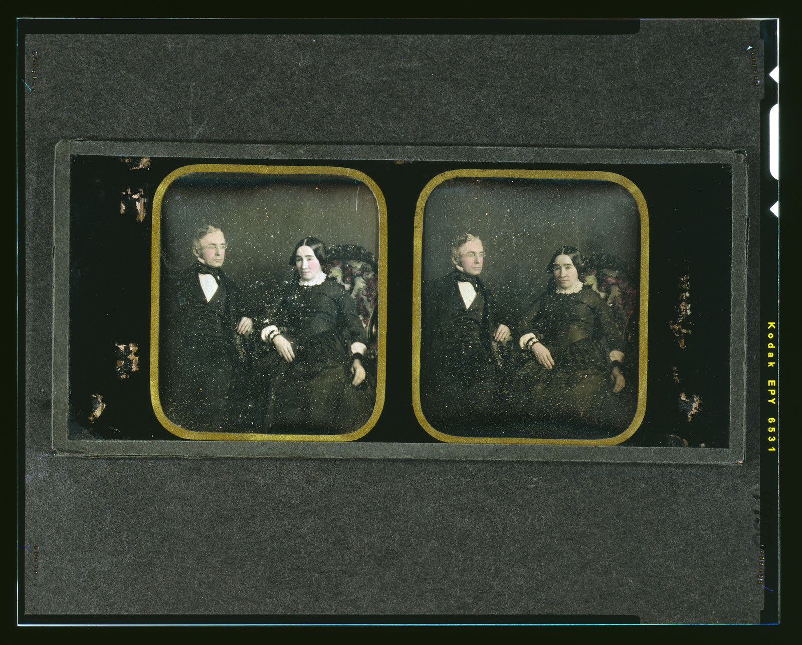 Hand-colored daguerreotype stereo pair of a seated older couple, 1850 — historic photograph