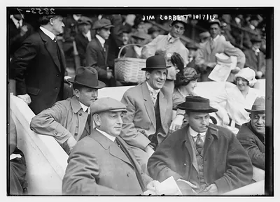 Boxer Jim Corbett (center) and Blossom Seeley (wife of Rube Marquard) to Corbett's left at Game One of the 1913 World Series at the Polo Grounds New York (baseball)