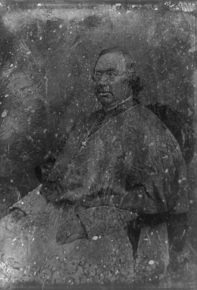 [Nicholas Patrick Wiseman, three-quarter length portrait, seated in armchair, three-quarters to the left, in clerical robe]