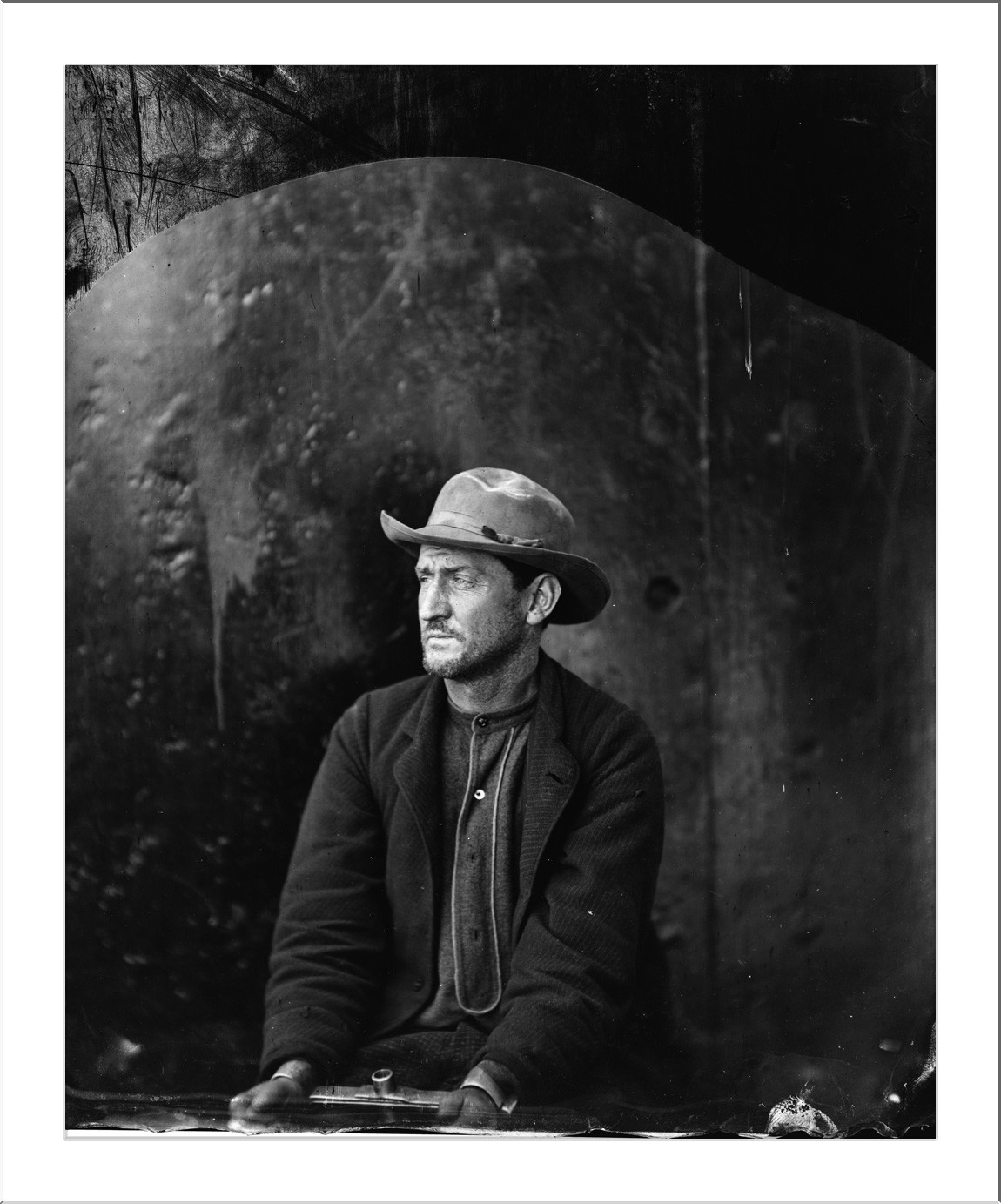 Seated man in hat, 19th-century portrait photograph — historic photograph
