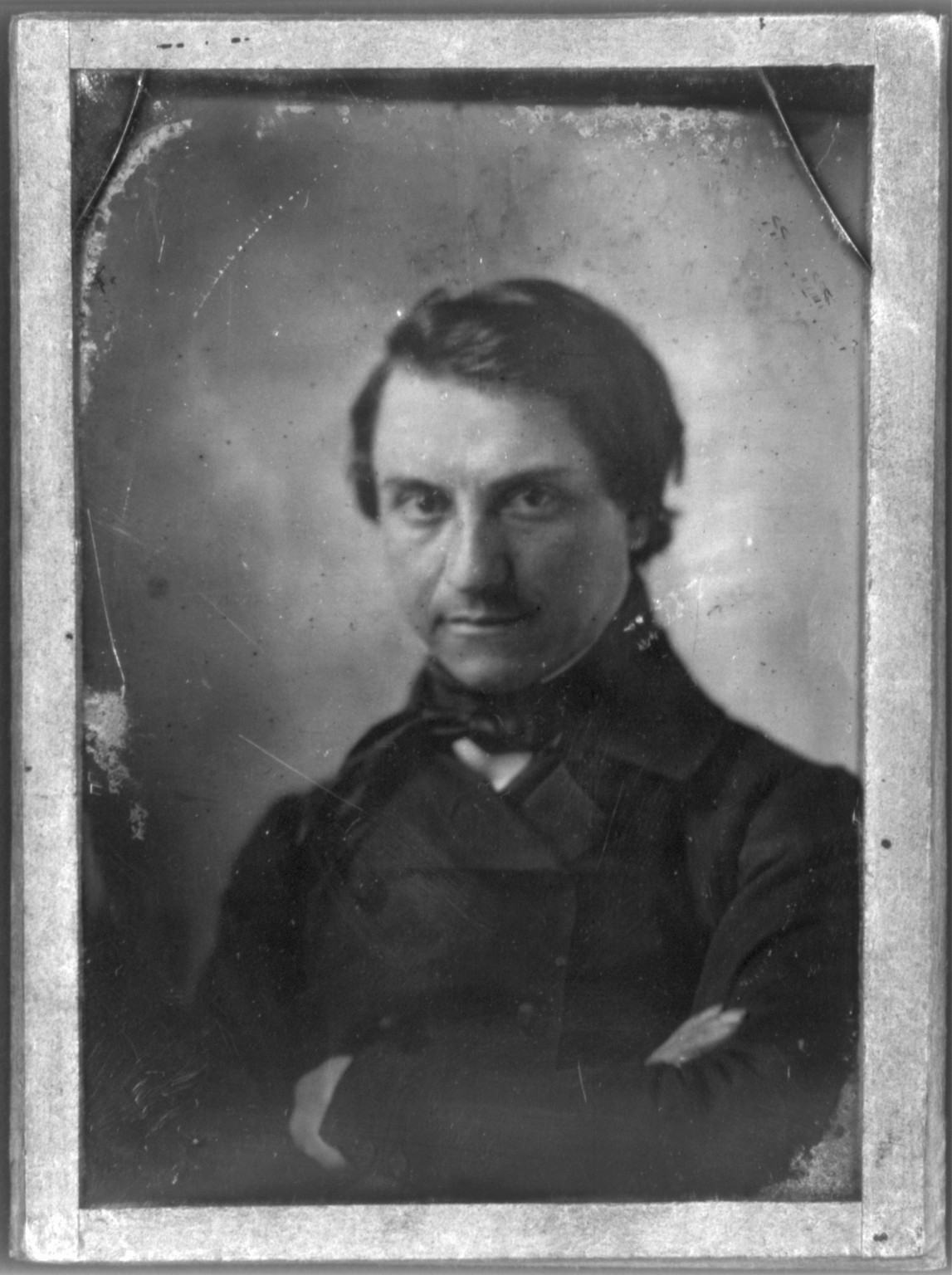 Unidentified man, half-length daguerreotype portrait, arms crossed, 1851 — historic photograph