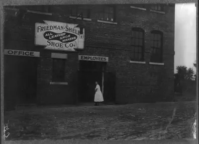 Young girl working in Friedman Shelby Shoe Factory,. Location: Kirksville, Missouri.