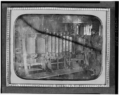 Worker beside large machine, daguerreotype occupational portrait